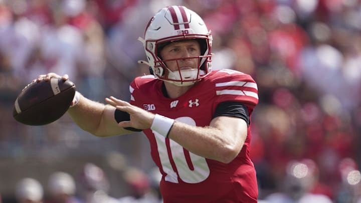 Sep 14, 2024; Madison, Wisconsin, USA;  Wisconsin Badgers quarterback Tyler Van Dyke (10) throws a pass during the first quarter against the Alabama Crimson Tide at Camp Randall Stadium.