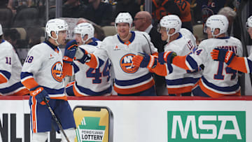 Mar 18, 2025; Pittsburgh, Pennsylvania, USA;  New York Islanders left wing Pierre Engvall (18) celebrates with the New York bench after scoring the game winning goal against the Pittsburgh Penguins during the third period at PPG Paints Arena. Mandatory Credit: Charles LeClaire-Imagn Images