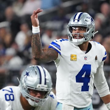 Dallas Cowboys quarterback Dak Prescott gestures at the line of scrimmage against the Las Vegas Raiders at Allegiant Stadium.