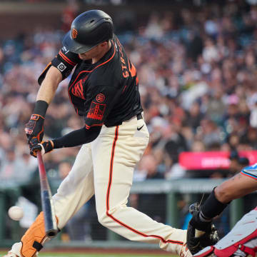 Aug 31, 2024; San Francisco, California, USA; San Francisco Giants outfielder Mike Yastrzemski (5) hits into an RBI fielders choice against the Miami Marlins during the fifth inning at Oracle Park. 