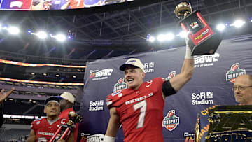 Dec 18, 2024; Inglewood, CA, USA;    RUNLV Rebels linebacker Jackson Woodard (7) holds his defensive player of the game trophy as wide receiver Jacob De Jesus (21) was named offensive player of the game after defeating the California Golden Bears in the LA Bowl at SoFi Stadium. Mandatory Credit: Jayne Kamin-Oncea-Imagn Images