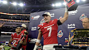 UNLV Rebels linebacker Jackson Woodard (7) holds his defensive player of the game trophy as wide receiver Jacob De Jesus (21) was named offensive player of the game after defeating the California Golden Bears in the LA Bowl at SoFi Stadium. Mandatory Credit: Jayne Kamin-Oncea-Imagn Images