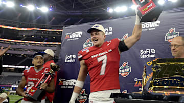 UNLV Rebels linebacker Jackson Woodard (7) holds his defensive player of the game trophy as wide receiver Jacob De Jesus (21) was named offensive player of the game after defeating the California Golden Bears in the LA Bowl at SoFi Stadium. Mandatory Credit: Jayne Kamin-Oncea-Imagn Images