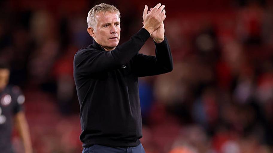 Phil Parkinson, Manager of Wrexham, applauds the fans at the end of the Carabao Cup first round match.