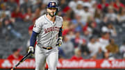 Sep 27, 2025; Anaheim, California, USA; Houston Astros first baseman Christian Walker (8) tosses his bat after hitting a solo home run against the Los Angeles Angels during the ninth inning at Angel Stadium.