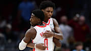 Nov 19, 2025; Cleveland, Ohio, USA; Houston Rockets guard Amen Thompson (1) hugs Houston Rockets guard Aaron Holiday (0) after the Rockets defeated the Cleveland Cavaliers at Rocket Arena. Mandatory Credit: David Dermer-Imagn Images