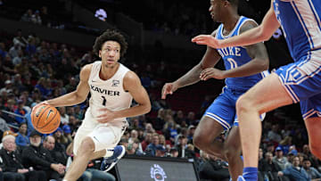 Nov 25, 2022; Portland, Oregon, USA; Duke basketball recruiting target Desmond Claude (1) drives to the basket during the first half against Duke Blue Devils forward Dariq Whitehead (0) at Moda Center.