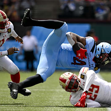 Mar 30, 2024; Arlington, TX, USA; Arlington Renegades running back Leddie Brown (4) is tackled by Birmingham Stallions Damon Lloyd (51) and defensive back Ike Brown (29) during the first half at Choctaw Stadium. Mandatory Credit: Jerome Miron-Imagn Images