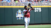 Jun 15, 2025; Omaha, Neb, USA;  Louisville Cardinals left fielder Zion Rose (32) makes an catch on the run against the Arizona Wildcats during the eighth inning at Charles Schwab Field. Mandatory Credit: Steven Branscombe-Imagn Images