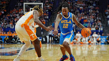 Mar 22, 2025; Lexington, KY, USA; UCLA Bruins guard Sebastian Mack (12) drives to the basket against Tennessee Volunteers forward Felix Okpara (34) during the second half in the second round of the NCAA Tournament at Rupp Arena. Mandatory Credit: Aaron Doster-Imagn Images
