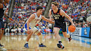 Mar 23, 2025; Raleigh, NC, USA; Connecticut Huskies forward Liam McNeeley (30) drives to the basket during the second half against Florida Gators guard Walter Clayton Jr. (1) in the second round of the NCAA Tournament at Lenovo Center. Mandatory Credit: Zachary Taft-Imagn Images