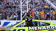 Sep 21, 2025; Loudon, New Hampshire, USA; NASCAR Cup Series driver Ryan Blaney (12) salutes fans after winning the Mobil 1 301 at New Hampshire Motor Speedway.