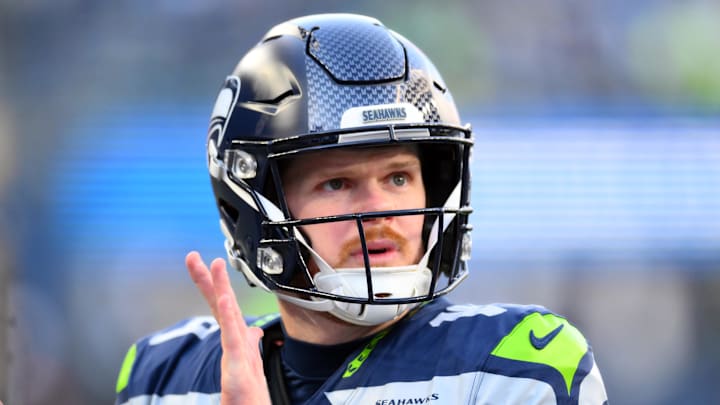 Seattle Seahawks quarterback Sam Darnold looks on