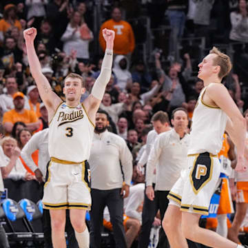 Purdue Boilermakers guards Braden Smith, Fletcher Loyer and center Zach Edey celebrate a trip to the Final Four