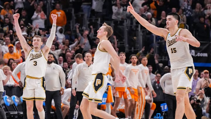 Purdue Boilermakers guards Braden Smith, Fletcher Loyer and center Zach Edey celebrate a trip to the Final Four