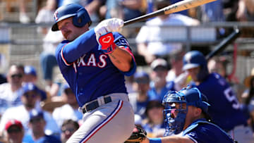 Mar 9, 2024; Phoenix, Arizona, USA; Texas Rangers first baseman Blaine Crim (74) bats against the Los Angeles Dodgers during the second inning at Camelback Ranch-Glendale. 