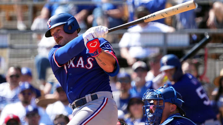 Mar 9, 2024; Phoenix, Arizona, USA; Texas Rangers first baseman Blaine Crim (74) bats against the Los Angeles Dodgers during the second inning at Camelback Ranch-Glendale.