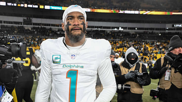 Dec 15, 2025; Pittsburgh, Pennsylvania, USA; Miami Dolphins quarterback Tua Tagovailoa (1) leaves the  field following a game against the Pittsburgh Steelers at Acrisure Stadium. Mandatory Credit: Barry Reeger-Imagn Images
