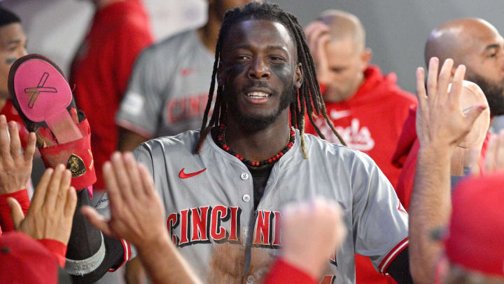 Aug 21, 2024; Toronto, Ontario, CAN;  Cincinnati Reds shortstop Elly De La Cruz (44) celebrates in the dugout with team mates after scoring against the Toronto Blue Jays and achieving his 60th stolen base of the season in the fifth inning at Rogers Centre. Mandatory Credit: Dan Hamilton-USA TODAY Sports