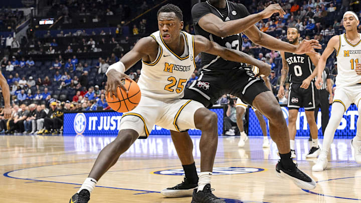 Missouri Tigers forward Mark Mitchell (25) drives on a defender, in a game versus the Mississippi State Bulldogs this season.