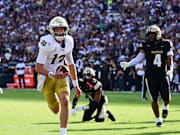 Sep 14, 2024; West Lafayette, Indiana, USA; Notre Dame Fighting Irish quarterback Riley Leonard (13) runs the ball in for a touchdown against the Purdue Boilermakers during the second quarter at Ross-Ade Stadium.