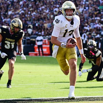 Sep 14, 2024; West Lafayette, Indiana, USA; Notre Dame Fighting Irish quarterback Riley Leonard (13) runs the ball in for a touchdown against the Purdue Boilermakers during the second quarter at Ross-Ade Stadium.