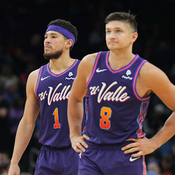 Feb 29, 2024; Phoenix, Arizona, USA; Phoenix Suns guard Devin Booker (1) and Phoenix Suns guard Grayson Allen (8) look on against the Houston Rockets  during the second half at Footprint Center. Mandatory Credit: Joe Camporeale-Imagn Images