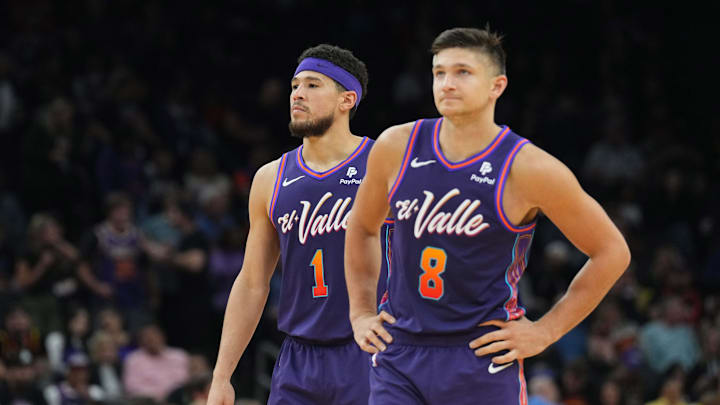 Feb 29, 2024; Phoenix, Arizona, USA; Phoenix Suns guard Devin Booker (1) and Phoenix Suns guard Grayson Allen (8) look on against the Houston Rockets  during the second half at Footprint Center. Mandatory Credit: Joe Camporeale-Imagn Images