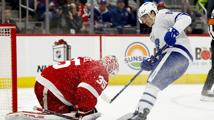 Dec 14, 2024; Detroit, Michigan, USA;  Detroit Red Wings goaltender Ville Husso (35) makes a save on Toronto Maple Leafs right wing Mitch Marner (16) in the third period at Little Caesars Arena. Mandatory Credit: Rick Osentoski-Imagn Images