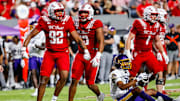 Aug 28, 2025; Raleigh, North Carolina, USA; North Carolina State Wolfpack defensive end Chase Bond (92) celebrates a sack against East Carolina Pirates quarterback Mike Wright Jr. (11) during the first half of the game  at Carter-Finley Stadium. Mandatory Credit: Jaylynn Nash-Imagn Images