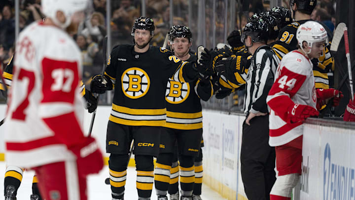 Jan 13, 2026; Boston, Massachusetts, USA; Boston Bruins defenseman Andrew Peeke (26) celebrates a goal by Pavel Zacha (not pictured) during the second period against the Detroit Red Wings at TD Garden. Mandatory Credit: Natalie Reid-Imagn Images