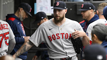 Boston Red Sox pitcher Garrett Crochet (35) high fives teammates after he pitched against the Chicago White Sox during the first inning at Guaranteed Rate Field.