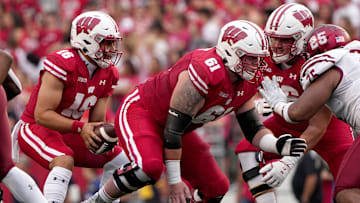 Wisconsin offensive lineman Dylan Barrett (61) snaps the ball to quarterback Myles Burkett (16) during the fourth quarter of their game Saturday, September 17, 2022 at Camp Randall Stadium in Madison, Wis. Wisconsin beat New Mexico State 66-7.

Mjs Uwgrid17 44 Jpg Uwgrid17 114441330