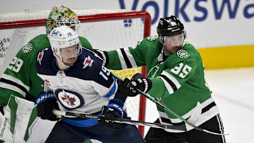 Apr 11, 2024; Dallas, Texas, USA; Dallas Stars center Matt Duchene (95) checks Winnipeg Jets center David Gustafsson (19) during the second period at the American Airlines Center. Mandatory Credit: Jerome Miron-Imagn Images