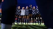 The Arizona soccer team huddled together before a match 