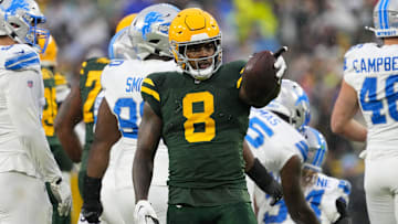 Nov 3, 2024; Green Bay, Wisconsin, USA;  Green Bay Packers running back Josh Jacobs (8) gestures after earning a first down during the first quarter against the Detroit Lions at Lambeau Field.