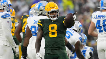 Nov 3, 2024; Green Bay, Wisconsin, USA;  Green Bay Packers running back Josh Jacobs (8) gestures after earning a first down during the first quarter against the Detroit Lions at Lambeau Field. Mandatory Credit: Jeff Hanisch-Imagn Images