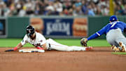 Aug 27, 2024; Boston, Massachusetts, USA; Boston Red Sox shortstop David Hamilton (70) steals second base against Toronto Blue Jays third baseman Will Wagner (7) during the fifth inning at Fenway Park. Mandatory Credit: Brian Fluharty-Imagn Images