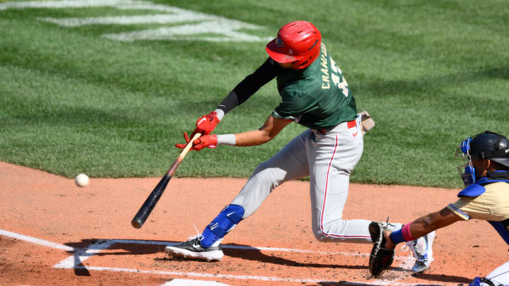 Jul 8, 2023; Seattle, Washington, USA; National League Futures designated hitter Justin Crawford (13) of the Philadelphia Phillies hits an RBI sacrifice fly against the American League during the second inning of the All Star-Futures game at T-Mobile Park.