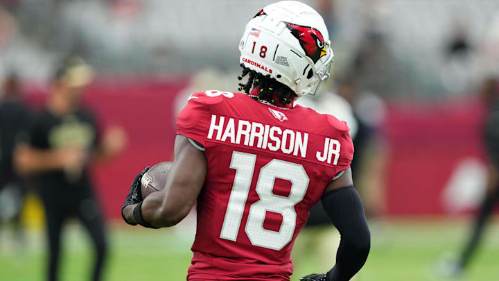 Aug 10, 2024; Glendale, Arizona, USA; Arizona Cardinals wide receiver Marvin Harrison Jr. (18) warms up before facing the New Orleans Saints at State Farm Stadium. Mandatory Credit: Joe Camporeale-Imagn Images