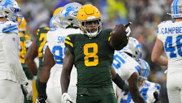 Nov 3, 2024; Green Bay, Wisconsin, USA;  Green Bay Packers running back Josh Jacobs (8) gestures after earning a first down during the first quarter against the Detroit Lions at Lambeau Field. Mandatory Credit: Jeff Hanisch-Imagn Images