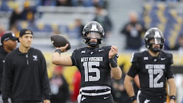 Oct 25, 2025; Morgantown, West Virginia, USA; West Virginia Mountaineers quarterback Scotty Fox Jr. (15) warms up prior to their game against the Texas Christian University Horned Frogs at Milan Puskar Stadium. Mandatory Credit: Ben Queen-Imagn Images