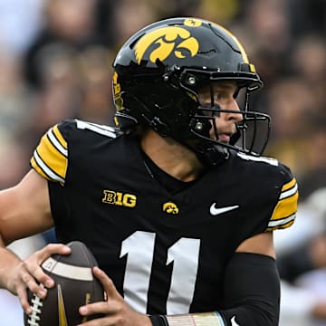 Oct 25, 2025; Iowa City, Iowa, USA; Iowa Hawkeyes quarterback Mark Gronowski (11) runs with the ball during the first quarter against the Minnesota Golden Gophers at Kinnick Stadium. Mandatory Credit: Jeffrey Becker-Imagn Images