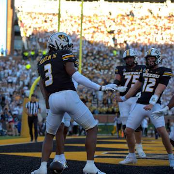 Sep 7, 2024; Columbia, Missouri, USA; Missouri Tigers wide receiver Luther Burden III (3) celebrates his touchdown with teammates Brady Cook (12) and Nate Noel (9) in a game against Buffalo.