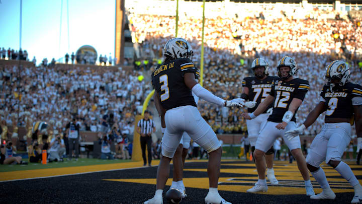 Sep 7, 2024; Columbia, Missouri, USA; Missouri Tigers wide receiver Luther Burden III (3) celebrates his touchdown with teammates Brady Cook (12) and Nate Noel (9) in a game against Buffalo.