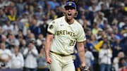 Oct 13, 2025; Milwaukee, Wisconsin, USA; Milwaukee Brewers relief pitcher Trevor Megill (29) reacts after a strikeout to end the eighth inning against the Los Angeles Dodgers during game one of the NLCS round for the 2025 MLB playoffs at American Family Field. Mandatory Credit: Benny Sieu-Imagn Images