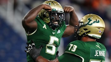 Nay`Quan Wright (5) is part of a grinding USF running attack