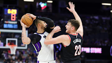 Oct 13, 2024; Sacramento, California, USA; Sacramento Kings center Alex Len (25) controls the ball against Portland Trail Blazers center Donovan Clingan (23) during the fourth quarter at Golden 1 Center. Mandatory Credit: Sergio Estrada-Imagn Images