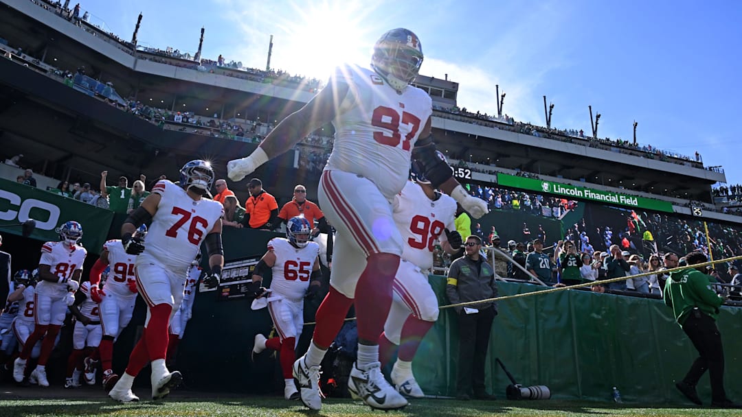 Defensive tackle Dexter Lawrence leads his team onto the field against the Eagles.