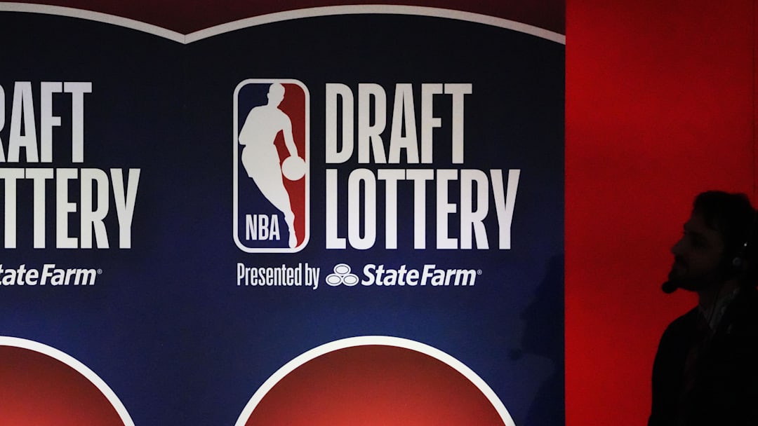May 12, 2025; Chicago, Illinois, US; A person watches the 2025 NBA Draft Lottery at McCormick Place. Mandatory Credit: David Banks-Imagn Images